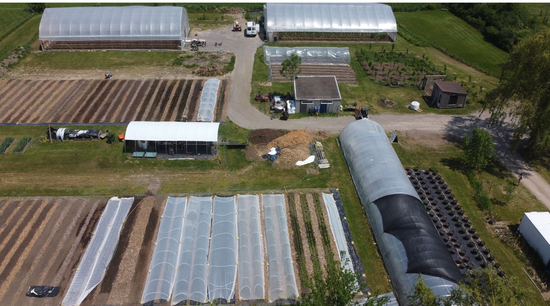 An aerial view of the fields, greenhouses and growing areas at Chez Nous Farm